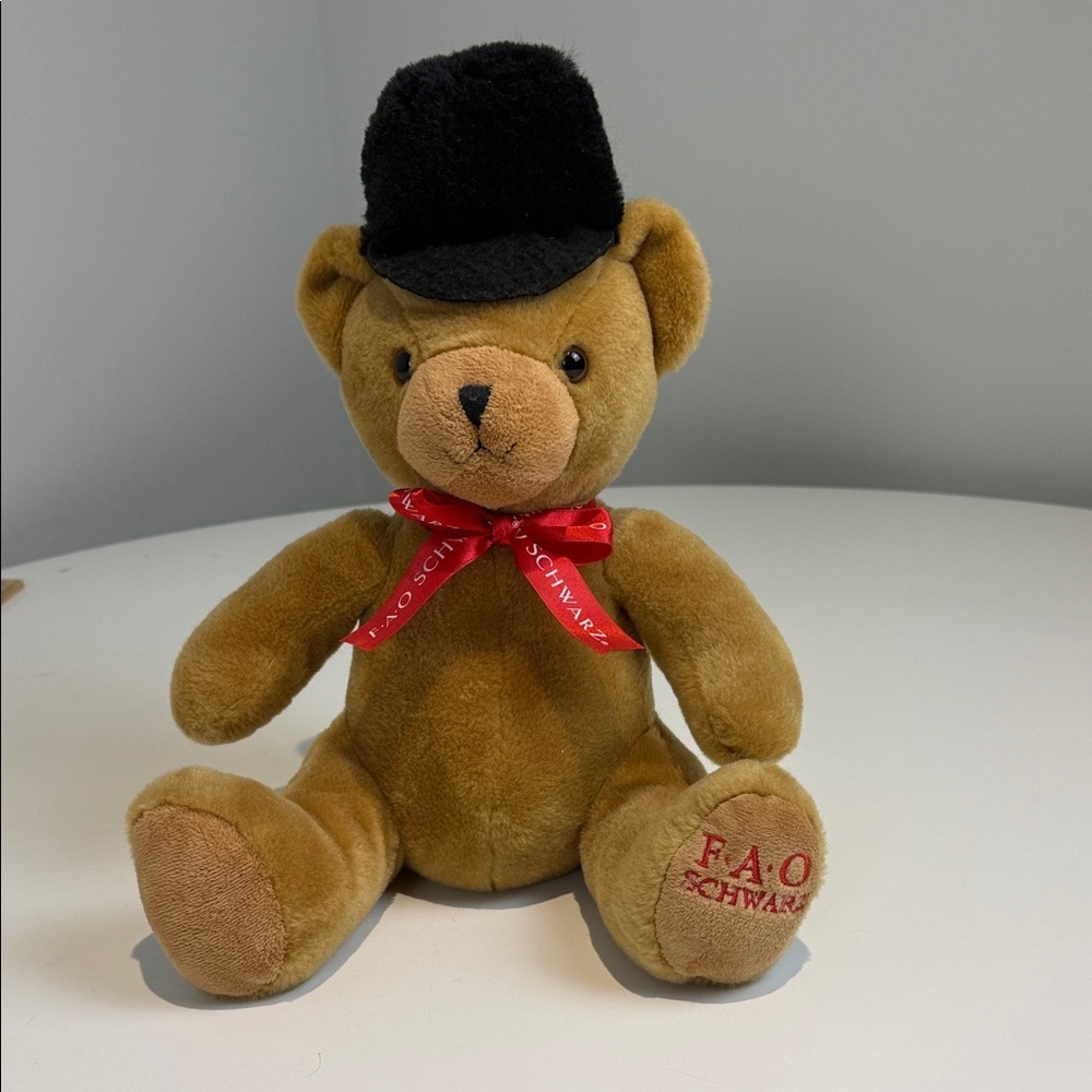 FAO Schwarz Tan Teddy Bear with Black Hat and Red Ribbon